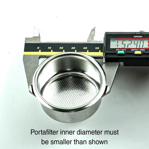 Barista-Grade 51mm Espresso Filter Basket With 593 Micro-Perforations For Even Extraction And Balanced Flavor held by calipers