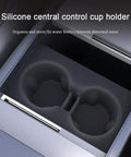 Slick White Silicone Cup Holder Tray For Tesla Model Y 2025 Center Console shows organized cup holder with secure grip design.