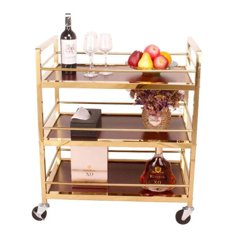 Heavy Duty Metal Serving Cart With Three Roomy Shelves And Slick Rolling Casters For Kitchen Organization Or Chill Bar Setup No Fuss Saves Floor Space Anywhere At Home Or Local Venue with wine bottles and fruit.
