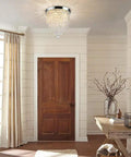 Three Light Crystal Chandelier Mini Flush Mount Ceiling Light Modern Pendant for Bedroom Hallway Bar, 12.2 Inch Height by 9.8 Inch Wide, G9 LED Bulbs Not Included, Cozy Warm Glow illuminating a modern entryway with wooden furniture and decor.