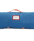 Team Spirit Nap Mat Set With Built In Pillow And Plush Blanket All In One Portable Nap Gear rolled with handle visible.