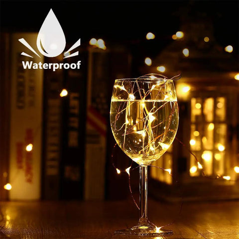 2 Pack Solar String Lights 132Ft Of Warm White LED Fairy Lights, 400 LED Total, waterproof in a wine glass setup
