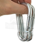 Close-up of two silver Maky Outdoors heavy-duty carabiners with spring-loaded gates held in hand