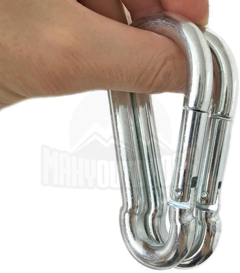 Close-up of two silver Maky Outdoors heavy-duty carabiners with spring-loaded gates held in hand