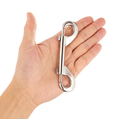 Double-ended bolt snap hook, silver metal, 4.7-inch length, held in hand