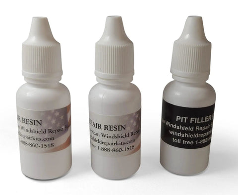 Pro Grade Windshield Repair Kit Essentials bottles with resin and pit filler for rock chip and crack fix DIY drill use.