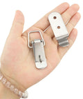 Close-up of 4 Pack 58mm Stainless Steel Heavy Duty Rust Resistant 90 Degree Tool Box Hood Locks Latches in hand