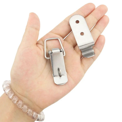 Close-up of 4 Pack 58mm Stainless Steel Heavy Duty Rust Resistant 90 Degree Tool Box Hood Locks Latches in hand