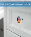 Slick Two Piece Round Cabinet Knobs And Drawer Pulls Featuring Hot Air Balloon Sunset Design With Hella Durable Stainless Steel Build For Kitchen Cabinets And Dressers That Feel Dang Sturdy And Look Sharp on white cabinet.