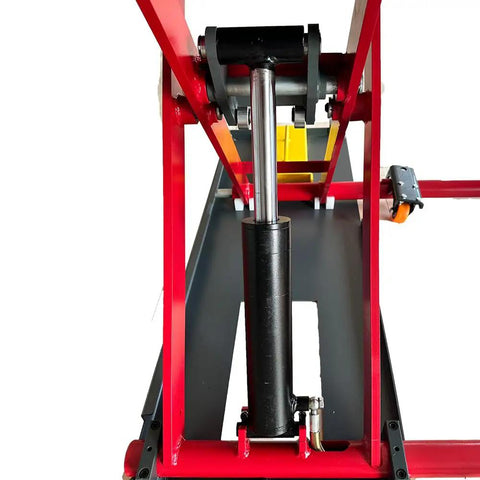 Close-up view of hydraulic system on Heavy Duty Eight Thousand Pound Scissor Lift With Lockable Drive Ramps.