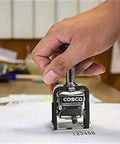 Top Shelf Six Wheel Automatic Numbering Machine Self Inking Office Stamp with hand stamping clear serial numbers on paper.