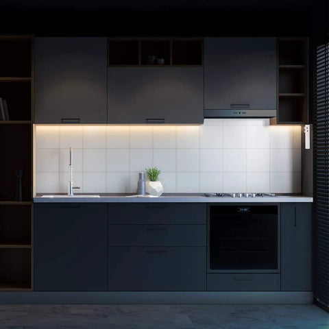 Dark kitchen with 2-Pack Rechargeable LED Strip Lights With Motion Sensor 2M Cool White under cabinet lighting, illuminating workspace.
