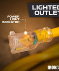 Close-up of Tough As Nails Heavy Duty Outdoor Extension Cord 75 Ft 10 Gauge with lit power light indicator on the plug.