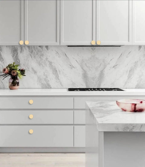 10 Pack Brushed Gold Round Cabinet Knobs For Kitchen Cabinets And Dressers, 1.2 Inch Diameter, Zinc Alloy Hardware installed on white cabinets