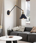 Badass Industrial Swing Arm Wall Sconce Adjustable Metal Light Fixture E27 Socket illuminating a cozy living space with stylish decor.