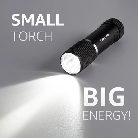 Compact LED Mini Flashlight With Tiny But Mighty Brightness, waterproof, emitting light on grey background
