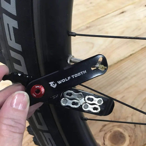Pack Pliers Bicycle Multi Tool With Master Link Pliers, Tire Levers, Valve Core Remover And Valve Stem Nut Wrench in use on bike
