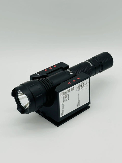 Emergency LED Wall Mount Flashlight TM603 1000 Lumen High Power Tactical Light on charging stand, angled view