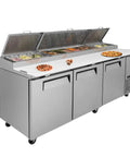 No Nonsense Heavy Duty Commercial Prep Table Refrigerator With Extra Wide Stainless Steel Worktop And Massive Cold Storage For Pizza And Sandwich Professionals with pizza and ingredients.