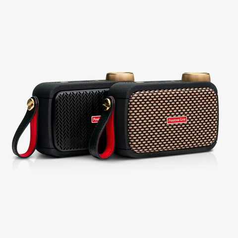 Two Ultra Portable 5W Smart Guitar Amps With Bluetooth Speaker Headphone Amp And Mobile App For Electric Acoustic Or Bass Guitars 33 Amps 43 Effects Custom Presets 50,000 ToneCloud Tones, side by side with grid and textured designs, with carrying straps.