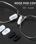 Hella Soft Anti Slip Silicone Eyeglass Nose Pads 18 Pair Replacement Kit With Cleaning Cloth Super Snug Grip Featherlight Allergy Free For Glasses And Sunglasses Small White, showing clear silicone pads on glasses.