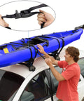 Man securing kayak on car roof rack with Beefy 16 Foot Tie Down Straps With Rubber Padded Cam Lock Buckle, 1 Inch Wide, 600 Lb Working Load.