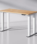Premium Four Leg Height Adjustable Standing Desk With Natural Maple Surface And Rock Solid Anti Wobble Engineering For No Stress Home Office And Multi Monitor Setups, showing natural maple surface and white frame.