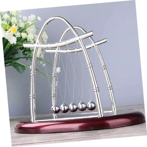 Newton's Cradle Pendulum Dynamics Learning Kit for Hands-On Education and Large Desk Decor, silver structure on red base.
