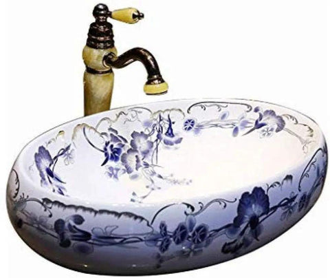 Heavy Duty Morning Glory Oval Bathroom Sink Crafted From Glossy Ceramic Featuring No Splash Countertop Mount And Sloped Drainage For Easy Cleanup And Total Powder Room Vibes with floral design and vintage faucet.