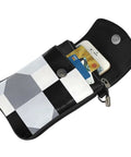 Slick Black And White Piano Plate Grid Print Crossbody Bag Crafted From Soft Water Repellent Synthetic Suede With Secure Strap showing open with phone and cards inside.