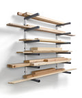 Six Level Wall Mounted Metal Lumber Rack For Garage Organization And Heavy Duty Wood Storage Shelf Pipe Holder Plywood Sheet Stand with stacked lumber.