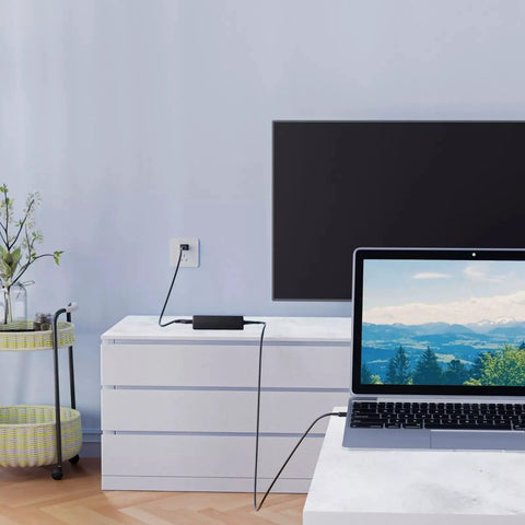 Global AC DC Power Adapter For Elecraft PX3 Ham Radio connected near a laptop on a white dresser, powering the device safely.