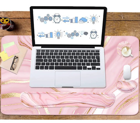 Large Extended Keyboard And Mouse Pad Set With Memory Foam Wrist Rests For Ergonomic Typing Ultra Smooth Desk Pad 3 Piece Pink Gold For Home Office Study And Gaming viewed from top with laptop placed on pink gold desk pad