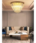 Modern K9 Crystal Gold Flush Mount Chandelier With 6 Lights, 3 Tier Round Ceiling Fixture in a living room, Brass Gold Finish