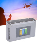 Mini 2Pro Three Channel USB Battery Charger Hub with digital display and ABS housing in use with drone in background.