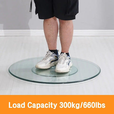 Person standing on Round Rotating Serving Plate With Large Tempered Glass Lazy Susan Turntable for Family Get Togethers