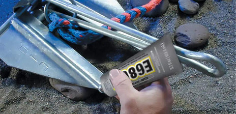 Hand applying Clear Industrial Adhesive With UV Resistance For Outdoor Use Built For Tough Bonding And High Flexibility 3.7 Fluid Ounces