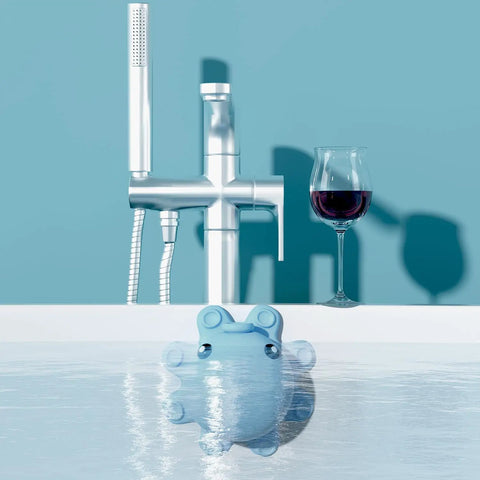 Heavy Duty Silicone Bathtub Overflow Drain Cover With Ironclad Suction Cups To Level Up Your Bathtub Game For Super Deep Chill Soaks In Vibrant Baby Blue Decor in water near modern faucet.