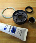 523 200 000 2 Repair Kit with Lubricating Grease 831-502-073-4 for linear slide unit, shown with parts on a wooden surface.