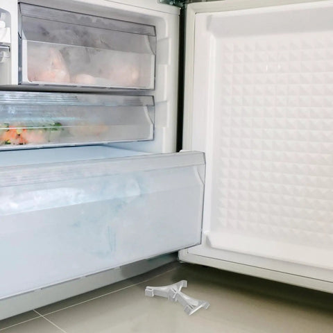 Open fridge door showing Aluminum Freezer Shelf Clips 10 Pack Refrigerator Shelf Supports Easy To Install on the floor.