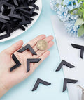 Kick Those Dull Scratches Straight To The Trash With These Heavy Duty Black Plastic Corner Protectors And L Shaped Bumpers Made To Keep Your Frames Mirrors And Glass Secure, shown with a coin for size reference.