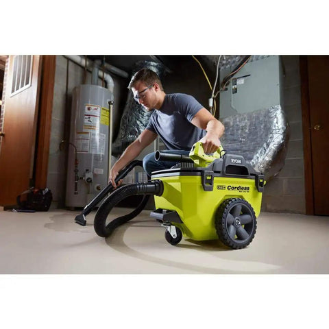 Person using 18V Cordless Wet Dry Vacuum 6 Gallon Tool Only Battery Not Included One Plus Compatible in a home garage setting.