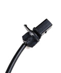 Front view of black disc brake pad wear sensor with rectangular electrical connector and cable