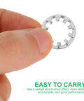 Close-up of a hand holding a single washer from the Stainless Steel Internal Tooth Locking Washers 300 Piece Star Shape Assortment Kit.
