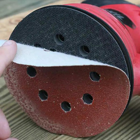 Super Tough 40 Piece 5 Inch Ultra Fine Aluminum Oxide Sanding Discs With Eight Hole Hook Loop Backing For Random Orbital Sanders and Auto Detailing Jobs In Assorted Grits 60 To 240 For Smooth Woodwork and Finish Work attached to a sander.