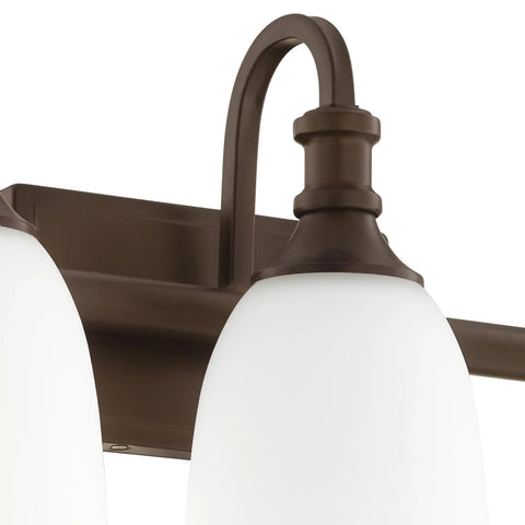Detail of oiled bronze finish fixture on Three Light Bathroom Vanity Light In Oiled Bronze With Clear Seeded Glass From The Richmond Collection