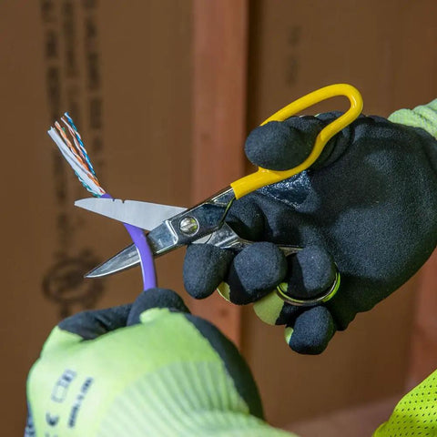 Cable Splicer Kit With Electricians Knife And Free Fall Snip Includes Leather Tool Holder For Belts Up To Two Inches The Essential Gear For Cable And Phone Techs On The Job showing gloved hands using snip on purple cable.