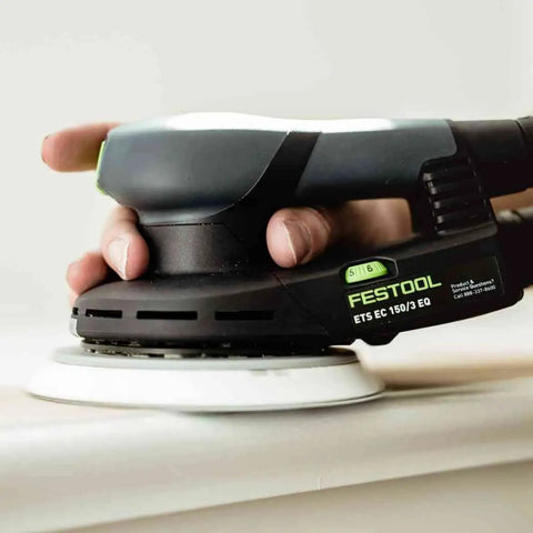 Topshelf Random Orbit Sander With Stepless Speed Control, ergonomic design in use on wooden surface for smooth finishing.