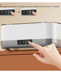 Portable Ultrasonic Cleaner With Rechargeable Battery For Jewelry And Watches showing control panel with display settings and hand operation.