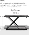 Height Adjustable Standing Desk Converter With 23.6 Inch Work Surface showing height range from 2.3 to 16 inches in black finish.